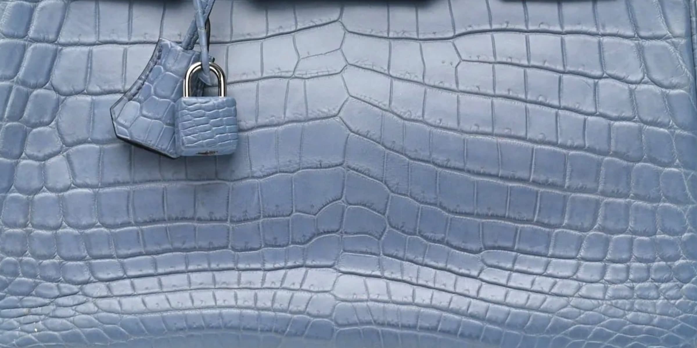 Matte crocodile scales across the body of a Bleu Ciel Birkin