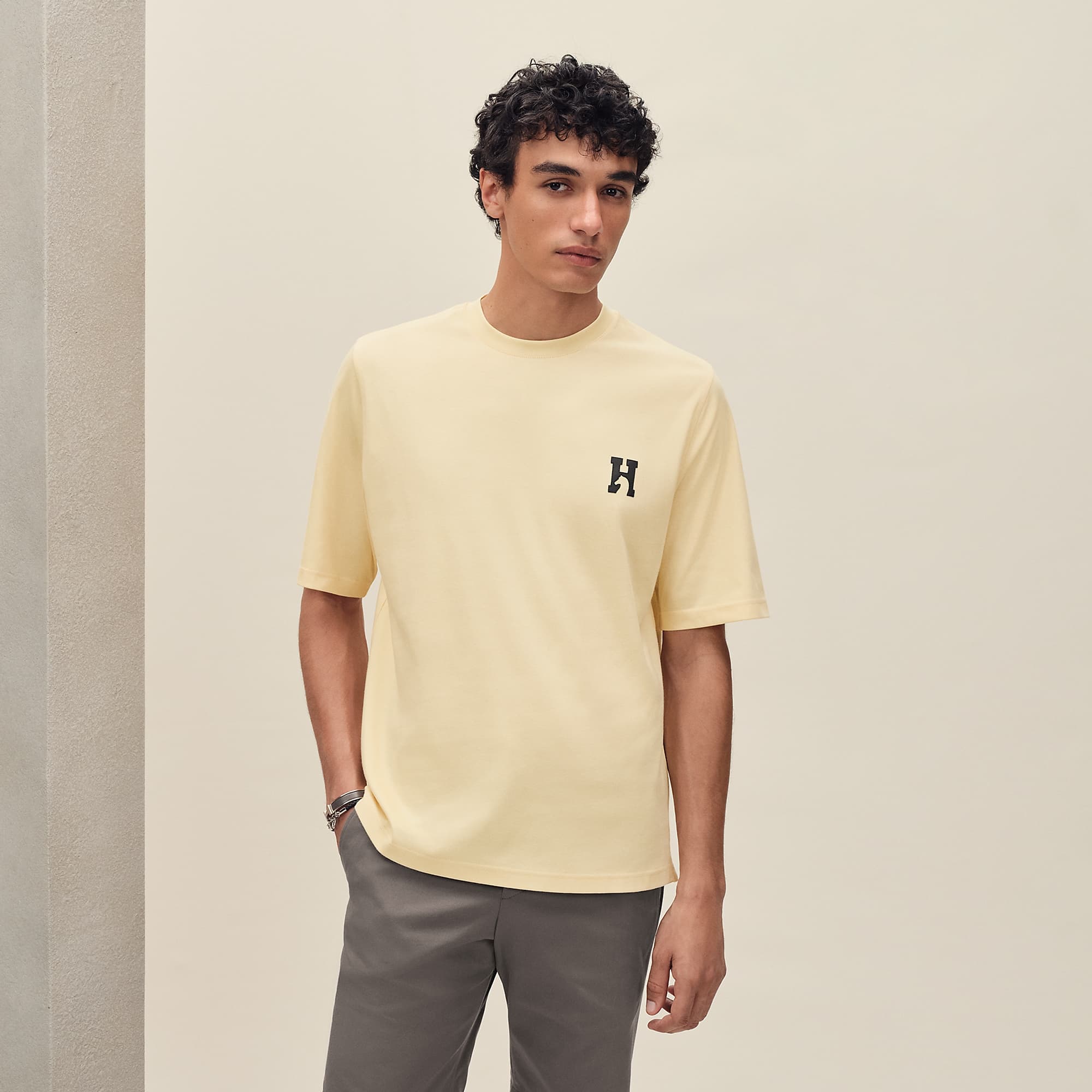 Model wearing the Hermès H’Cheval T-shirt in Vanille